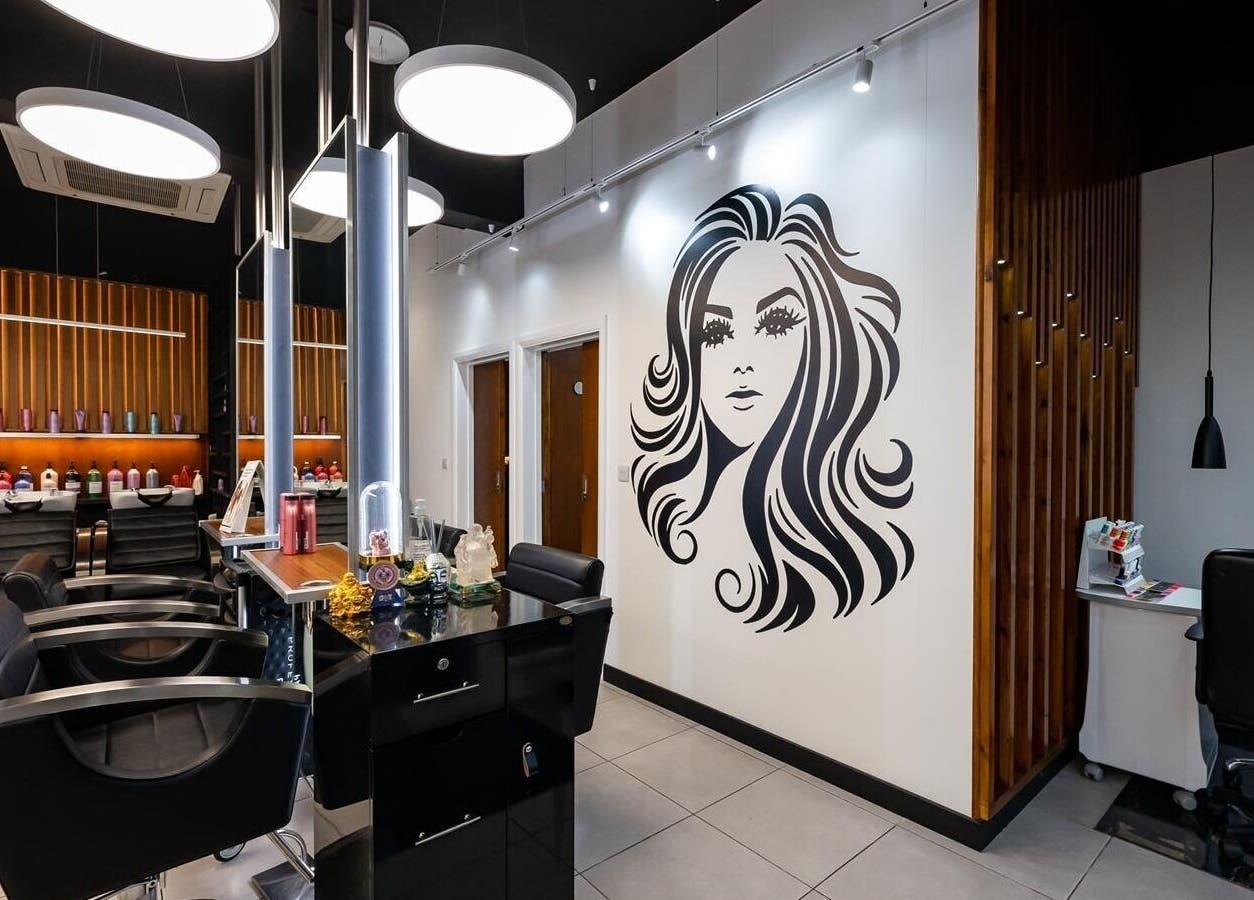 Interior of Kapil Hair Studio featuring stylish salon chairs and decor in Harrow, England, GB.