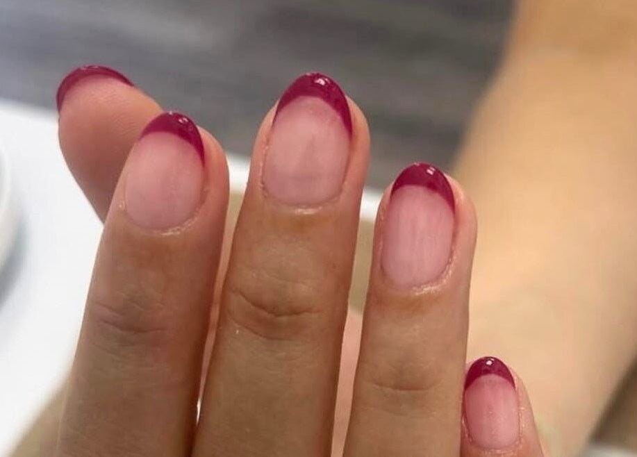Elegant pink-tipped manicure at The Beauty Space, Guildford, England, GB, highlighting quality nail care.