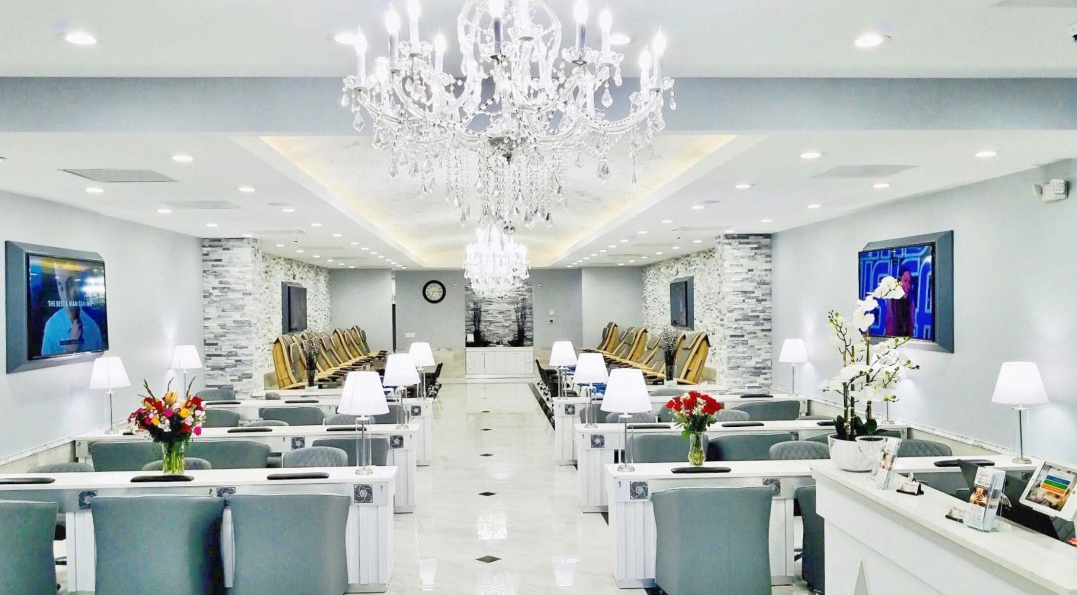 Luxurious Wynn Nail Spa interior in Maineville, Ohio, US with elegant chandeliers and stylish seating.