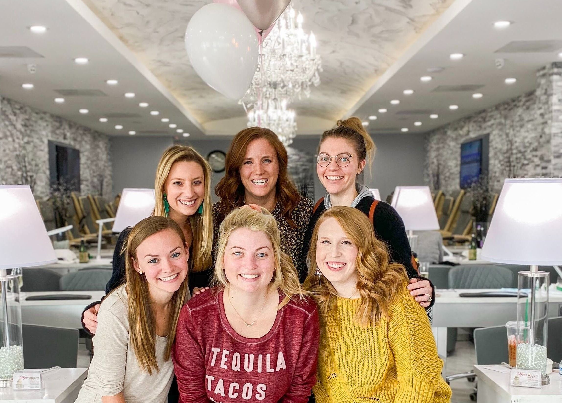 Group enjoying time at Wynn Nail Spa, Maineville, Ohio, US with modern décor and friendly atmosphere.