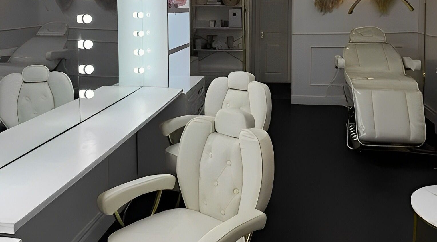 Elegant salon setup at Makeup and Beauty Bar, Edinburgh, Scotland, GB with plush chairs and vanity mirrors.