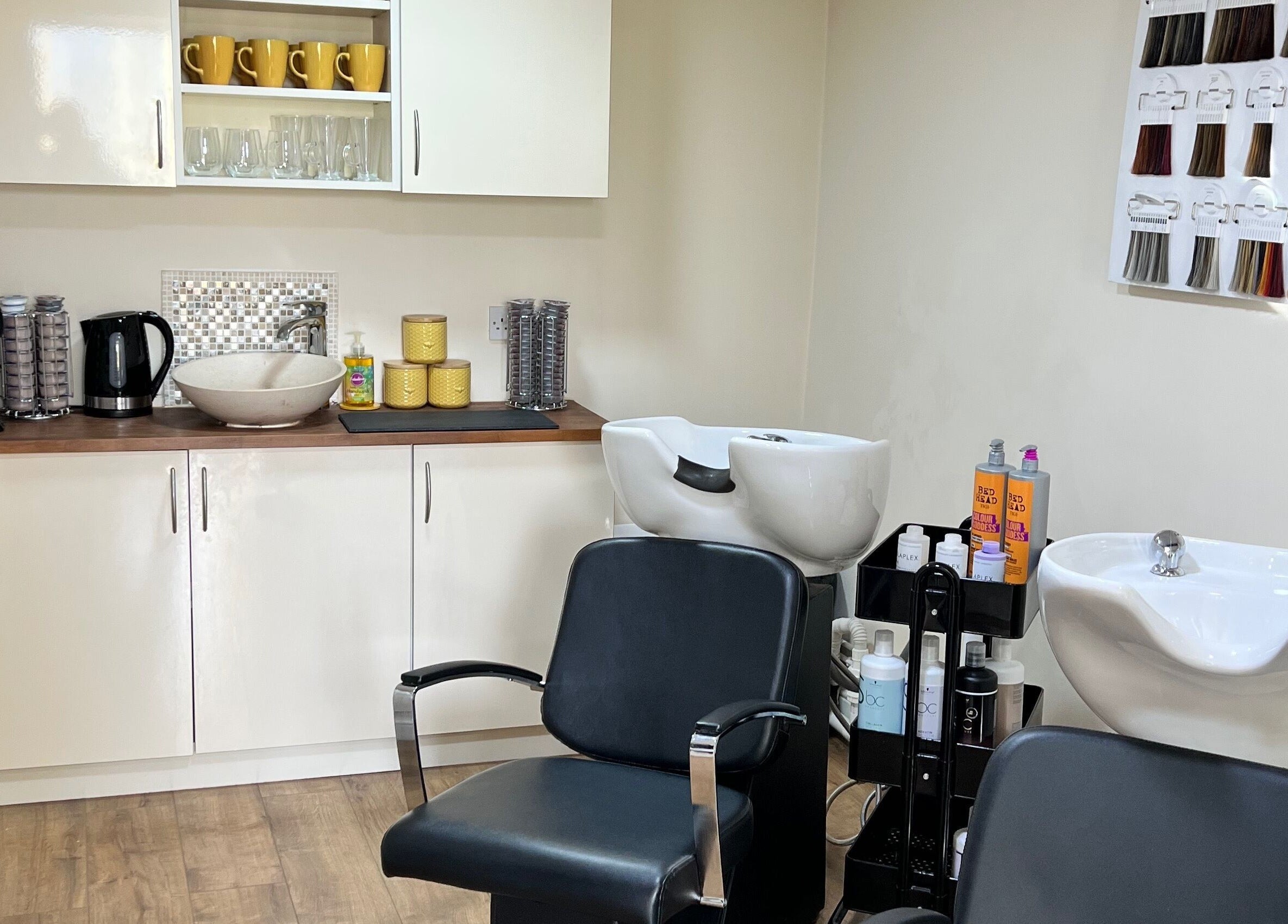 Interior of David Charles Hair, Health and Beauty Studio in Raunds, England, GB featuring sink and seating area.
