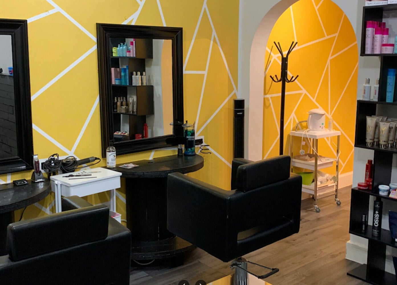 Modern salon interior at David Charles Hair, Health and Beauty Studio in Raunds, England, GB.