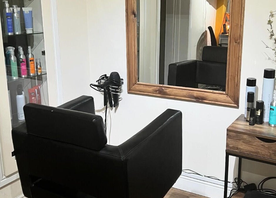 Elegant salon chair and mirror at David Charles Hair, Health and Beauty Studio, Raunds, England, GB.