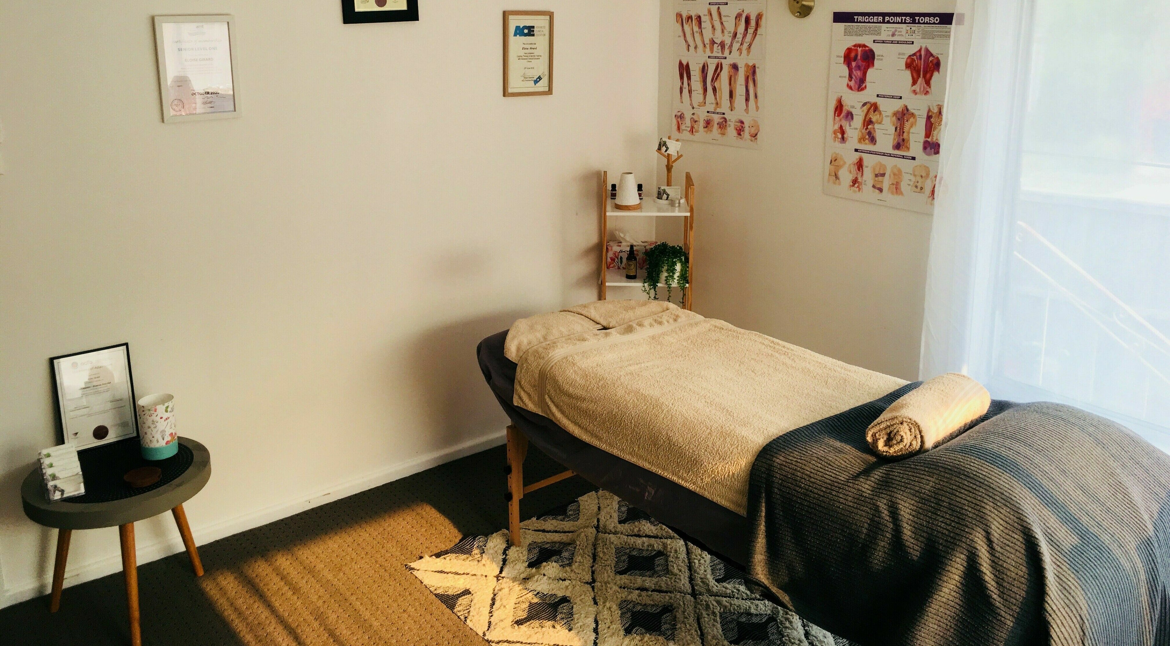 Cozy massage room at Streamflow Remedial Massage Therapy in Melbourne, Victoria, AU featuring a massage table and decor.