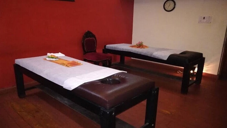 Relaxing massage room at Body Raaga Wellness Spa - Whitefield, Bengaluru, Karnataka, IN with two massage tables.