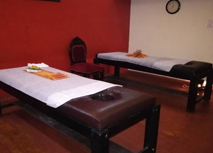 Relaxing massage room at Body Raaga Wellness Spa - Whitefield, Bengaluru, Karnataka, IN with two massage tables.