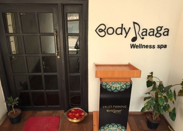 Entrance of Body Raaga Wellness Spa - Jp Nagar in Bengaluru, Karnataka, IN, showcasing a welcoming door and elegant decor.
