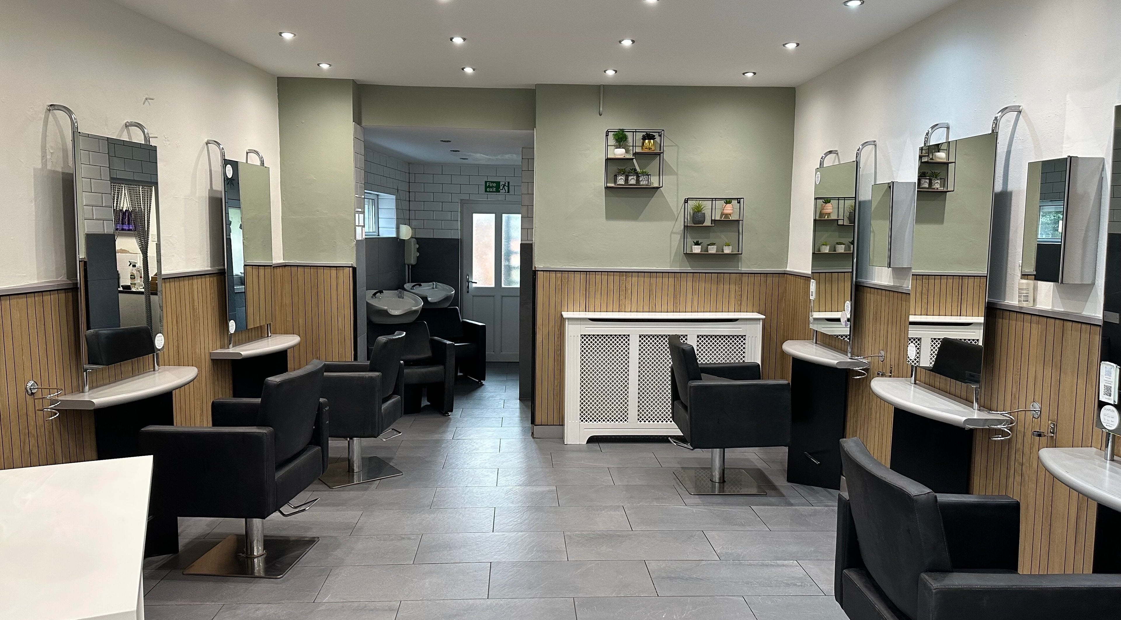 Elegant interior of Zig-Zag Hair & Beauty, Normanton, England, GB, showcasing modern hairdressing stations.