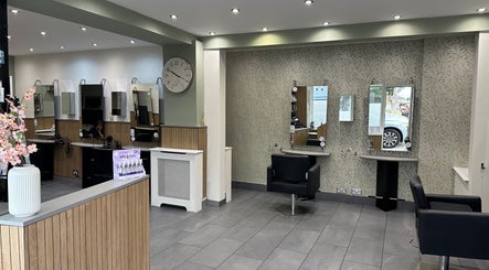 Elegant interior of Zig-Zag Hair & Beauty in Normanton, England, GB featuring modern styling chairs and decor.
