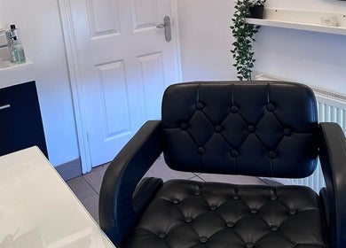 Stylish black salon chair in Zig-Zag Hair & Beauty, Normanton, England, GB, offering comfort and style.