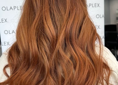 Beautiful wavy auburn hair styled at Zig-Zag Hair & Beauty, Normanton, England, GB.