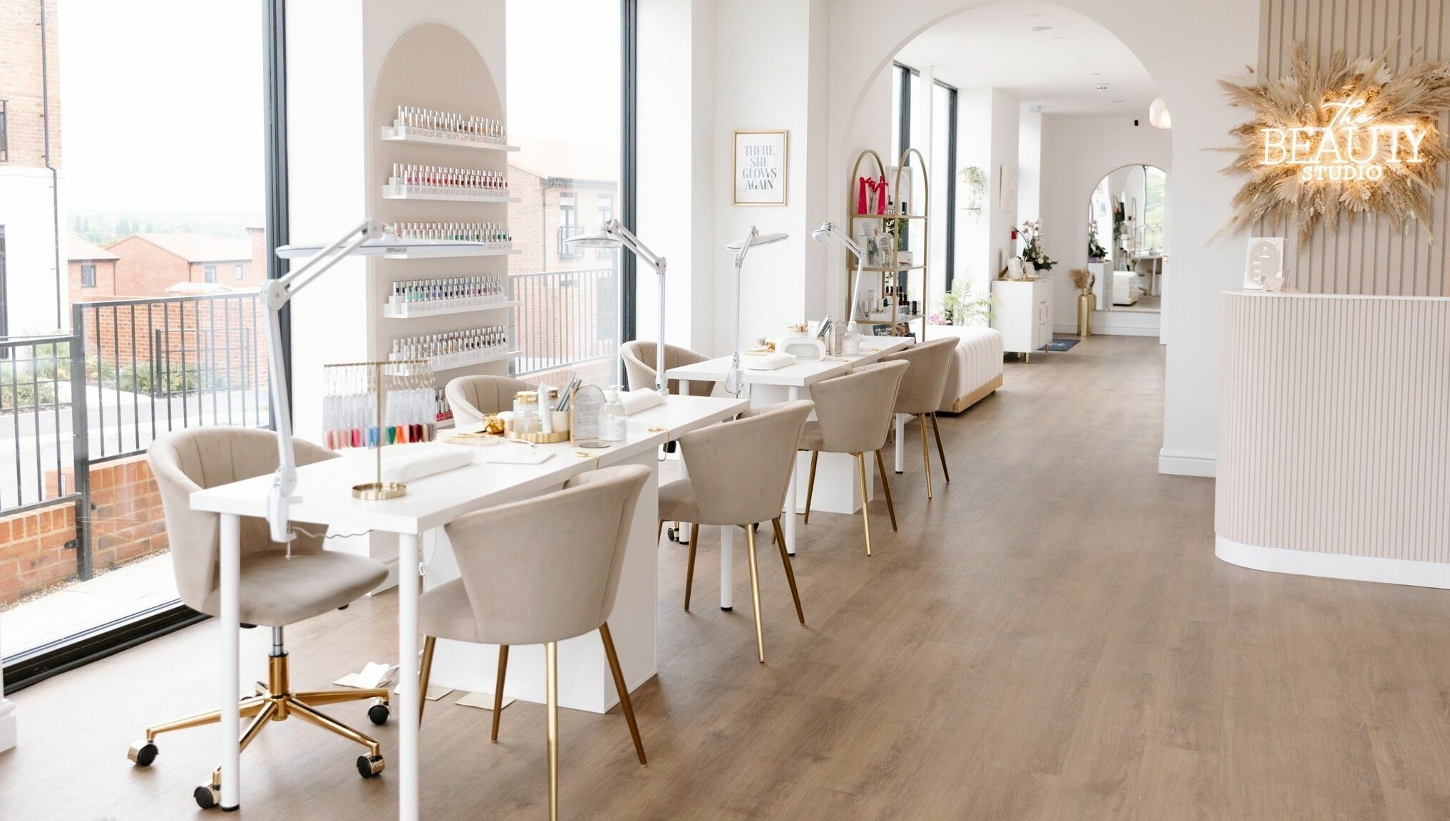 Bright, modern interior of The Beauty Studio in Canterbury, England, GB, featuring chic nail stations and a welcoming vibe.