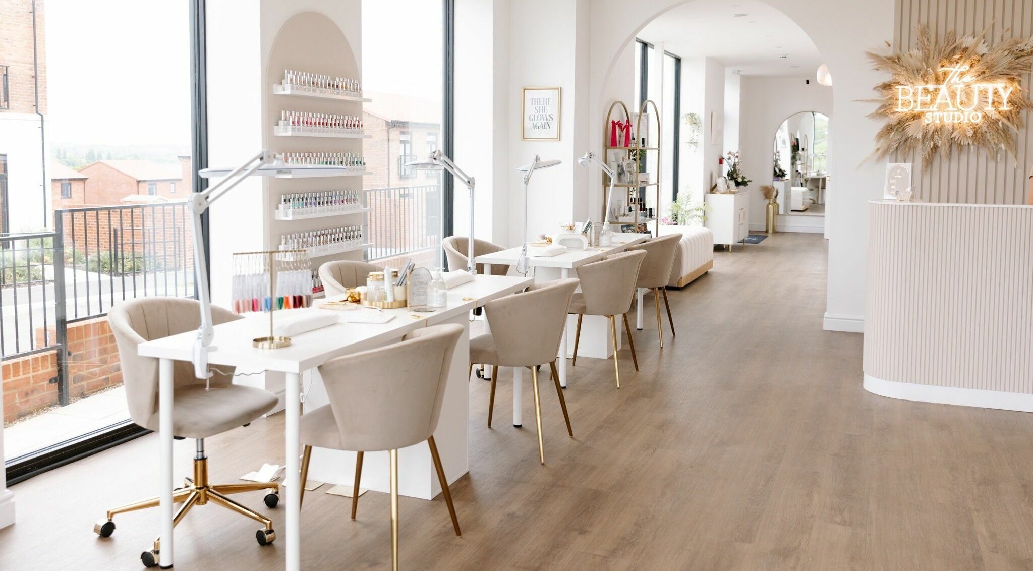 Bright, modern interior of The Beauty Studio in Canterbury, England, GB, featuring chic nail stations and a welcoming vibe.