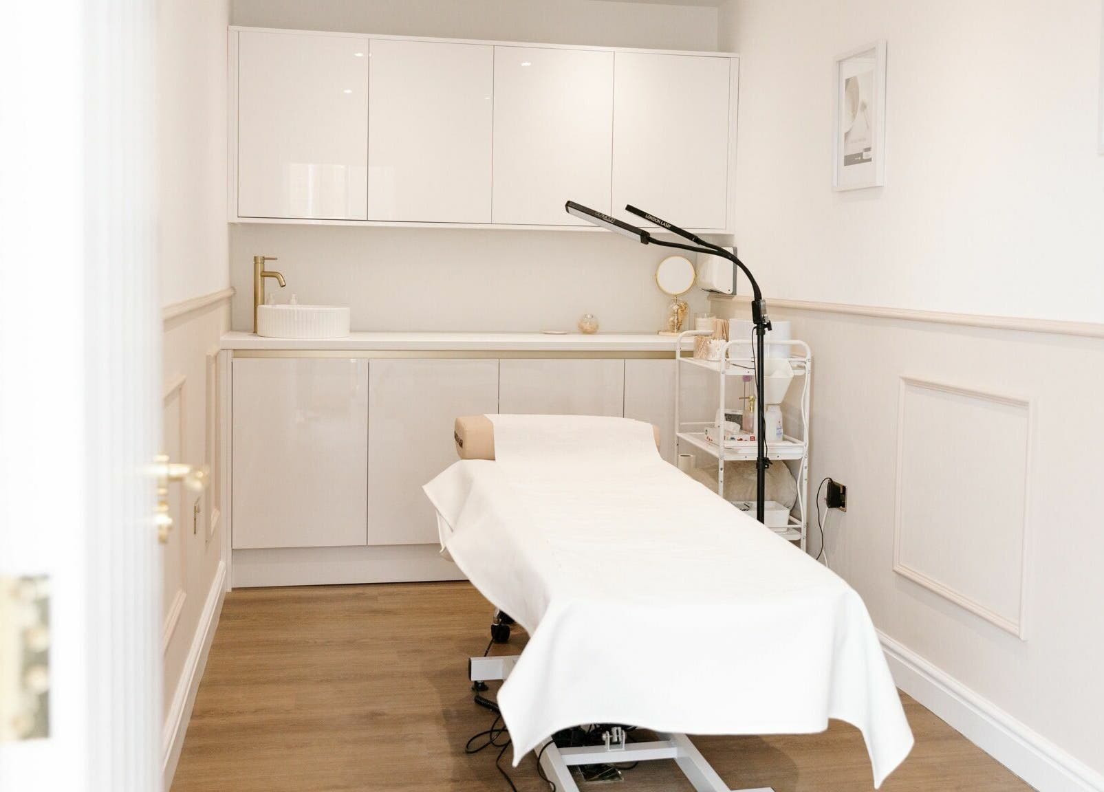 Relaxing treatment room at The Beauty Studio in Canterbury, England, GB featuring a cozy massage table.