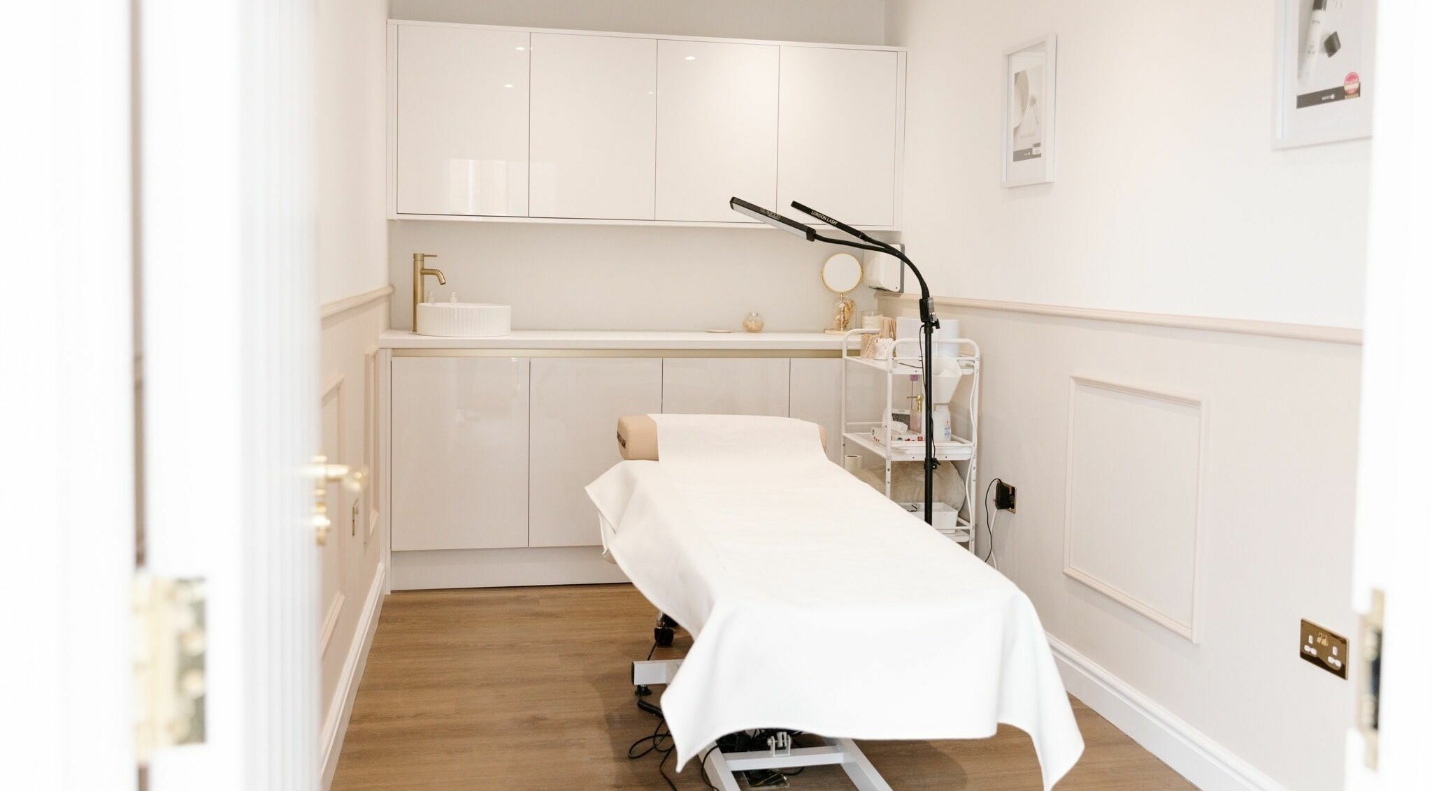Relaxing treatment room at The Beauty Studio in Canterbury, England, GB featuring a cozy massage table.