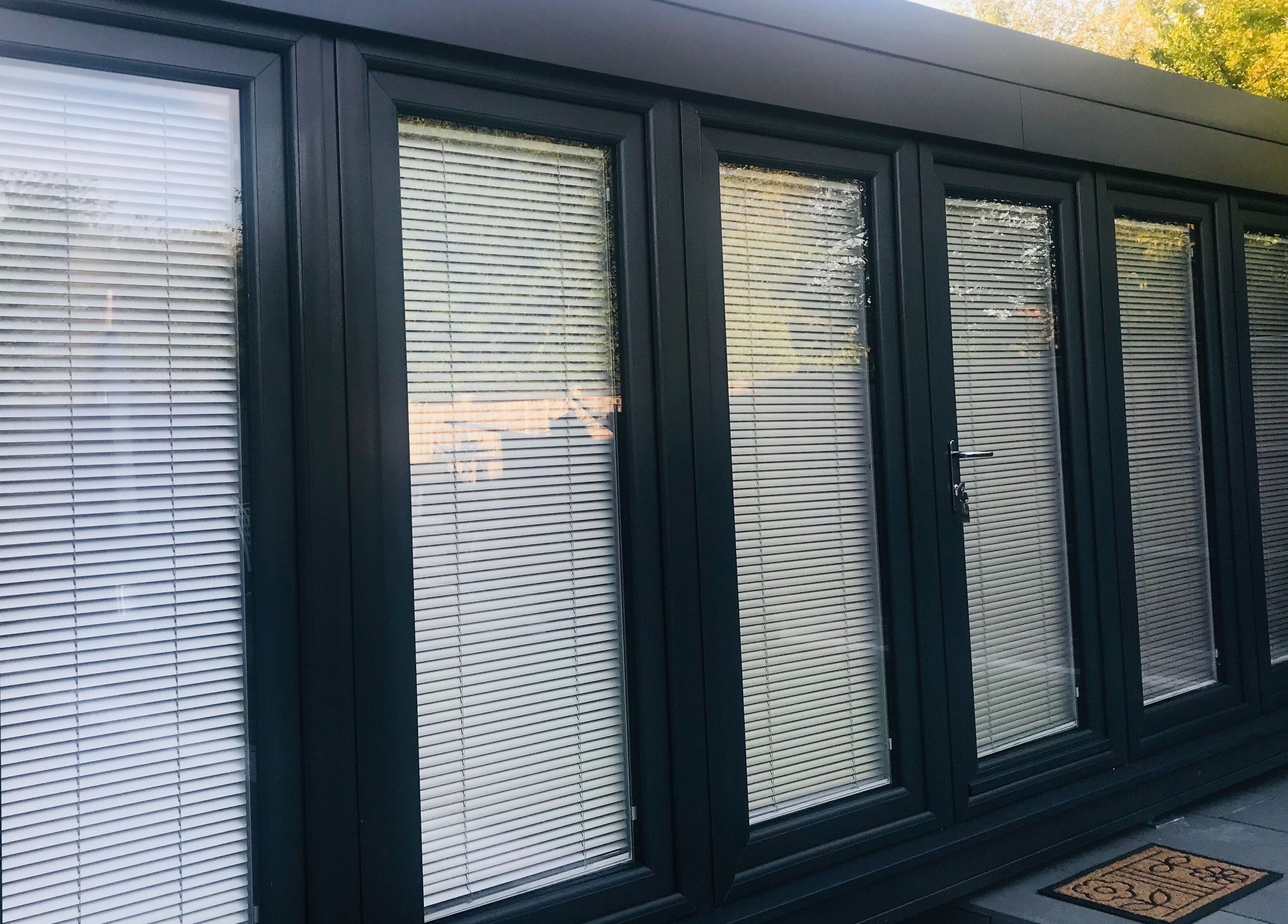 Exterior of Zero Fuzz Given in Chicksands, England, GB, featuring modern glass doors with blinds.
