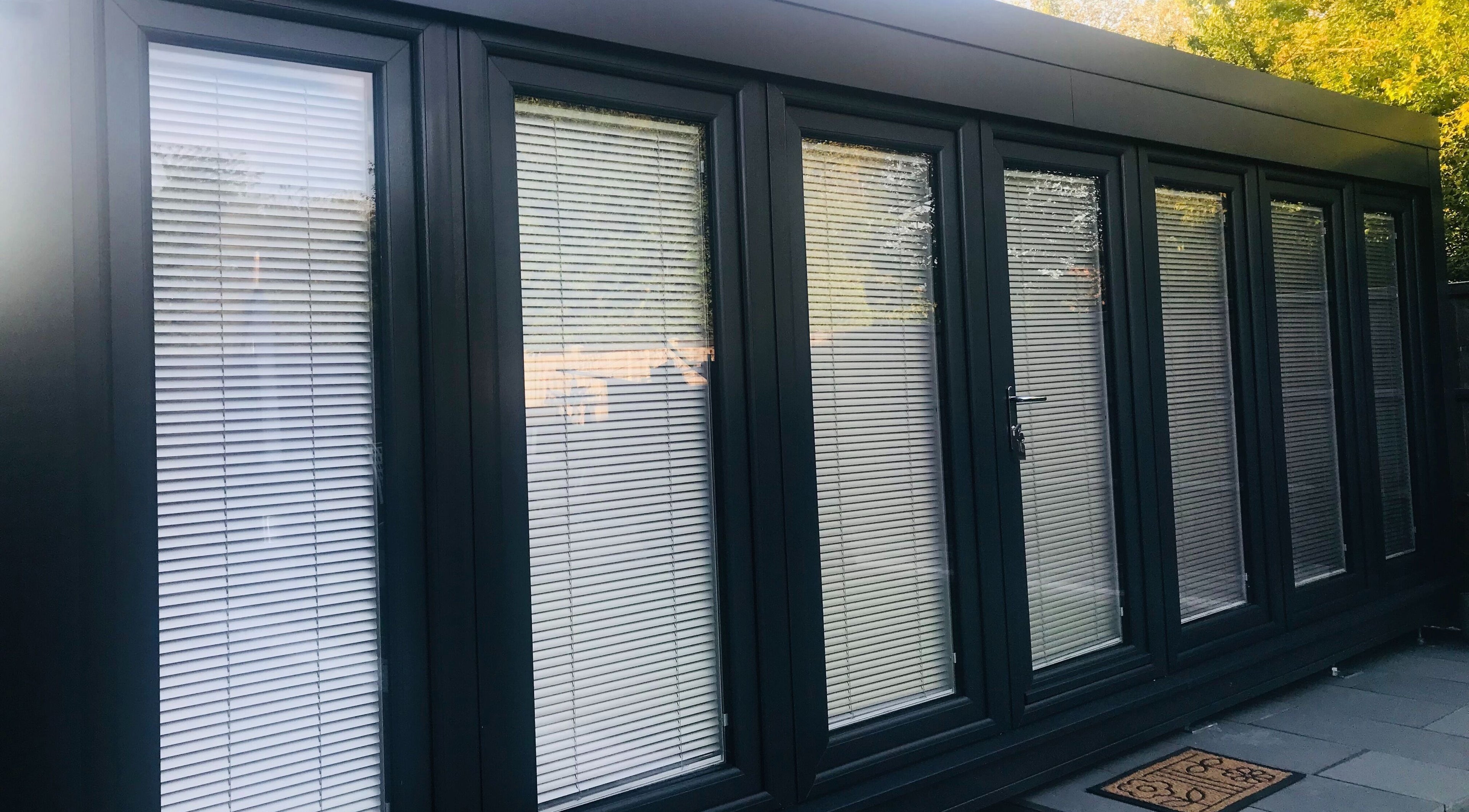 Exterior of Zero Fuzz Given in Chicksands, England, GB, featuring modern glass doors with blinds.