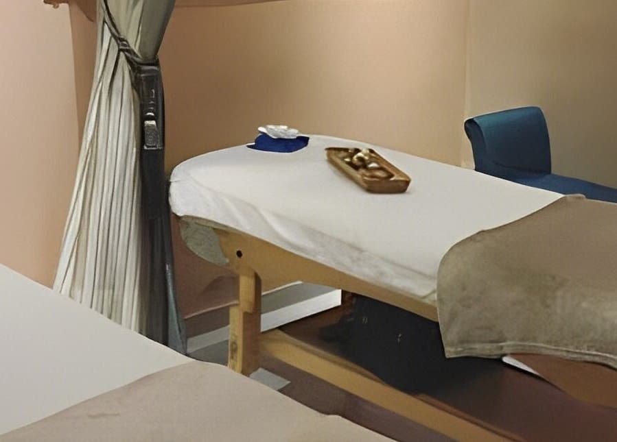Calming massage room at Rejuvenee Spa & Wellness Center, Lagos, Lagos, NG featuring a serene bed setup.