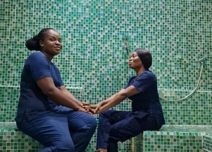 Two women enjoy a serene moment at Rejuvenee Spa & Wellness Center, Lagos, Lagos, NG in a mosaic tiled room.