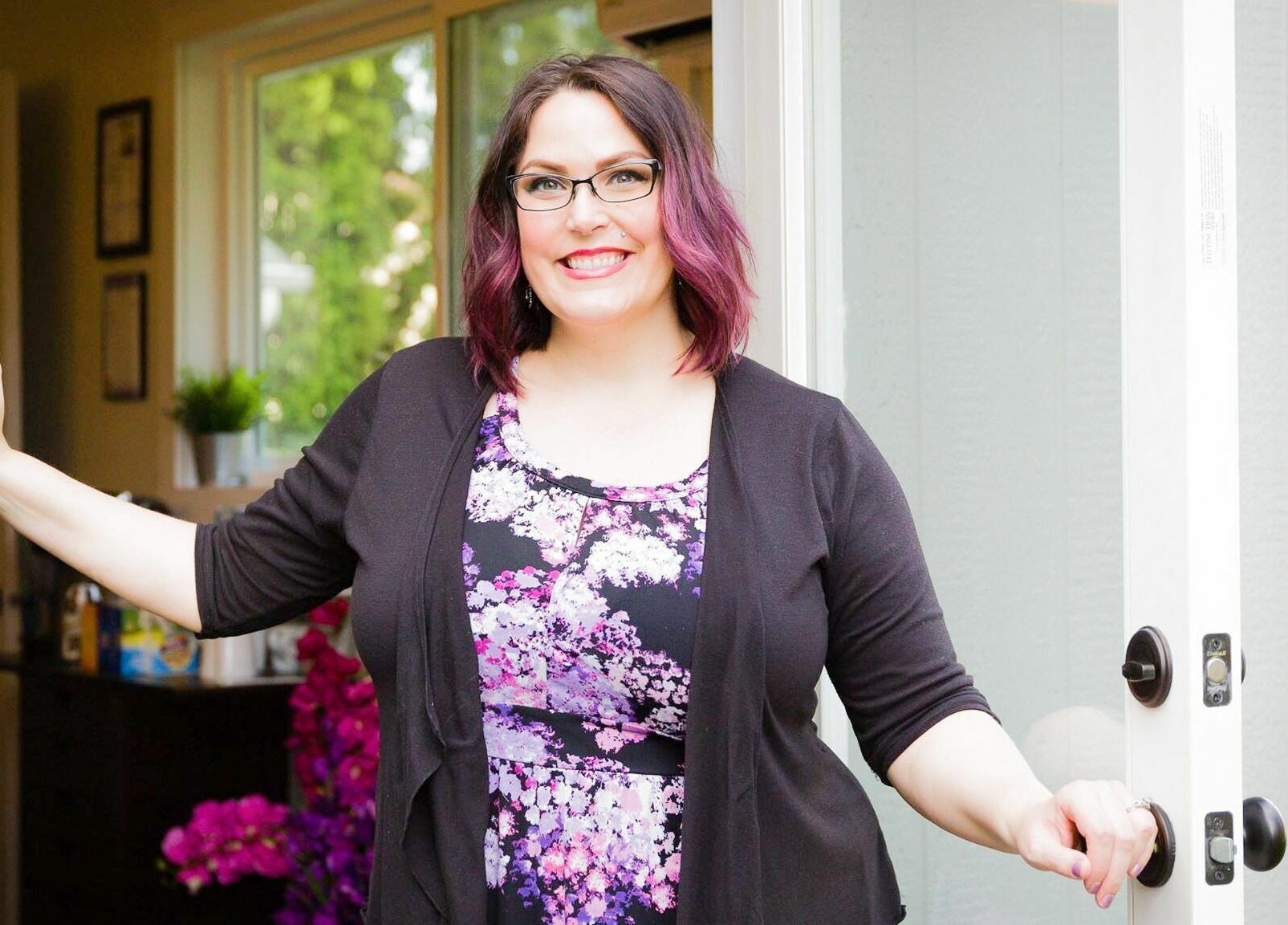 Smiling individual welcoming clients at Hair By Kyla, Vancouver, Washington, US.