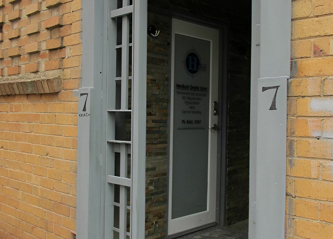Entrance to Helios Laser Studio, Melbourne, Victoria, AU, with modern door and brickwork.