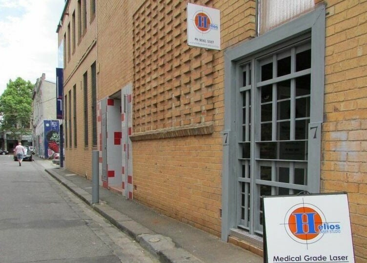 Street view of Helios Laser Studio, a brick building in Melbourne, Victoria, AU with visible studio sign.