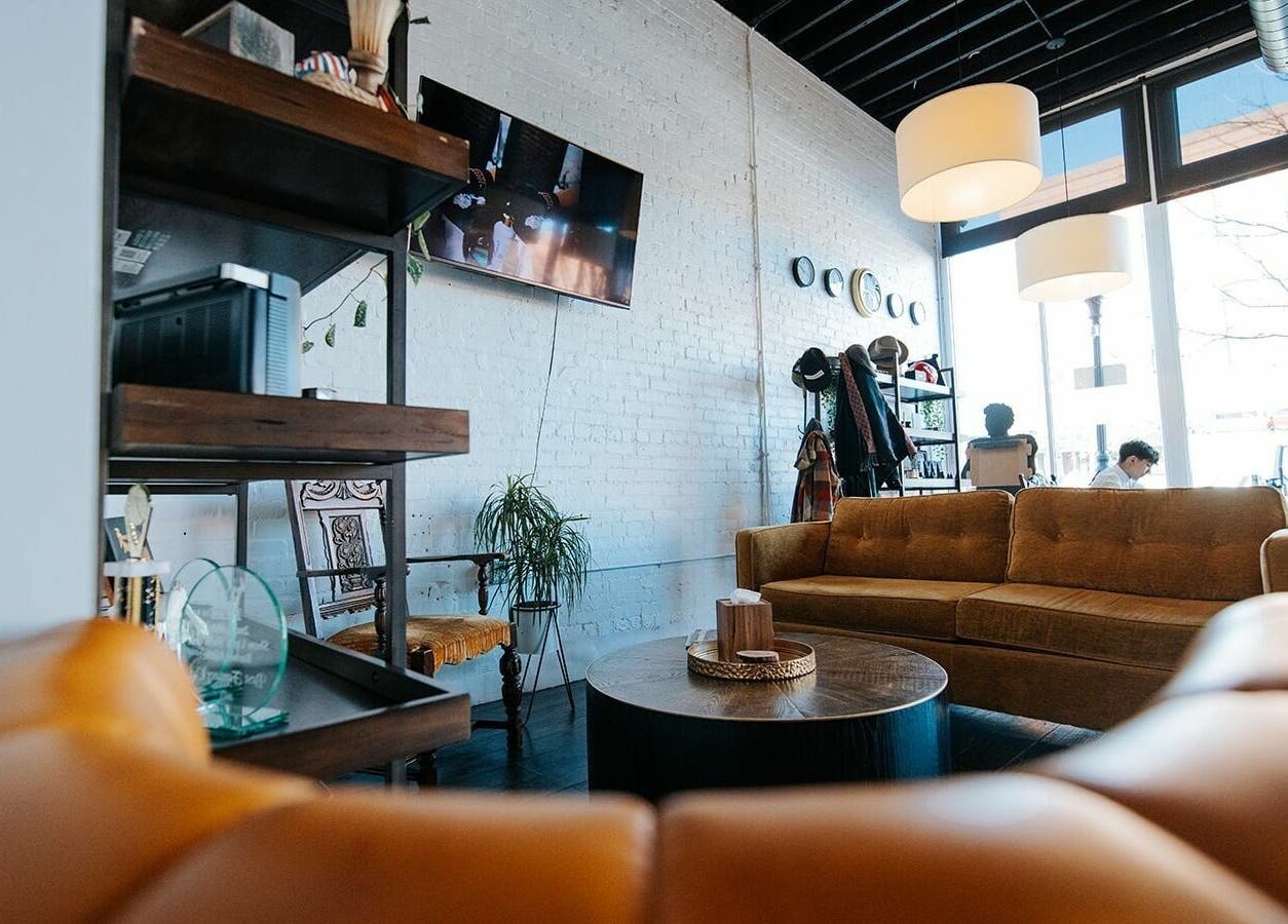 Cozy lounge area at B | K L A S S Y Barber Studio in Kansas City, Missouri, US with modern decor and inviting seating.