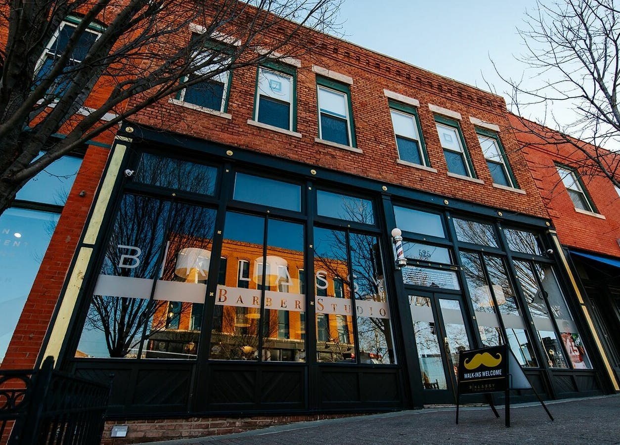 Street view of B | K L A S S Y Barber Studio, Kansas City, Missouri, showcasing its stylish brick exterior.