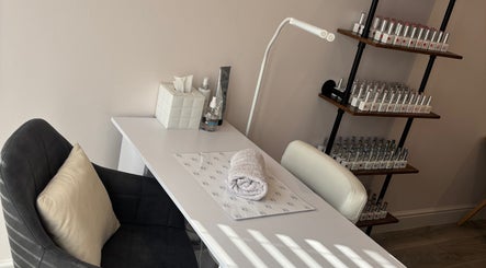 Cozy nail station at Beauty at The CowShed, Uttoxeter, England, GB showcasing polish collection and towel.