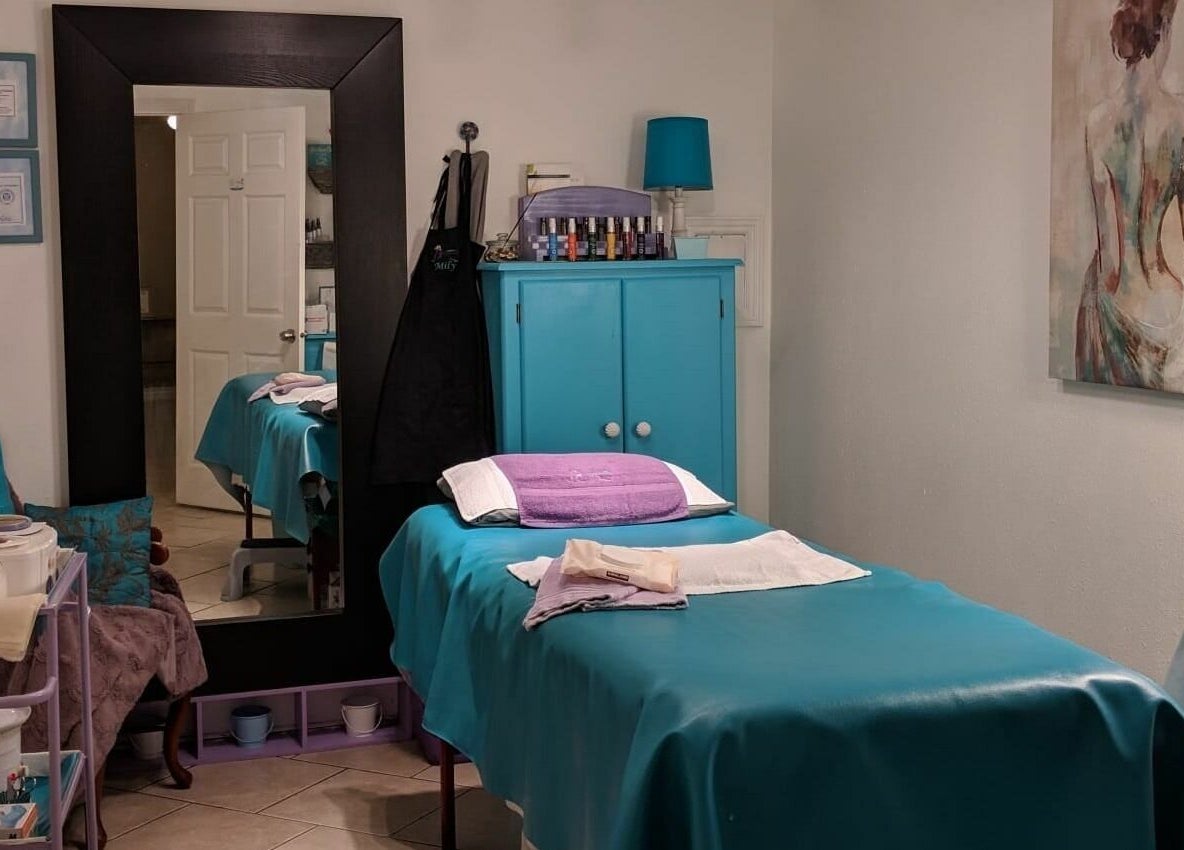 Relaxing treatment room at Always Smooth Waxing Studio in Taylorsville, Utah, US, showcasing a tidy and calming setup.
