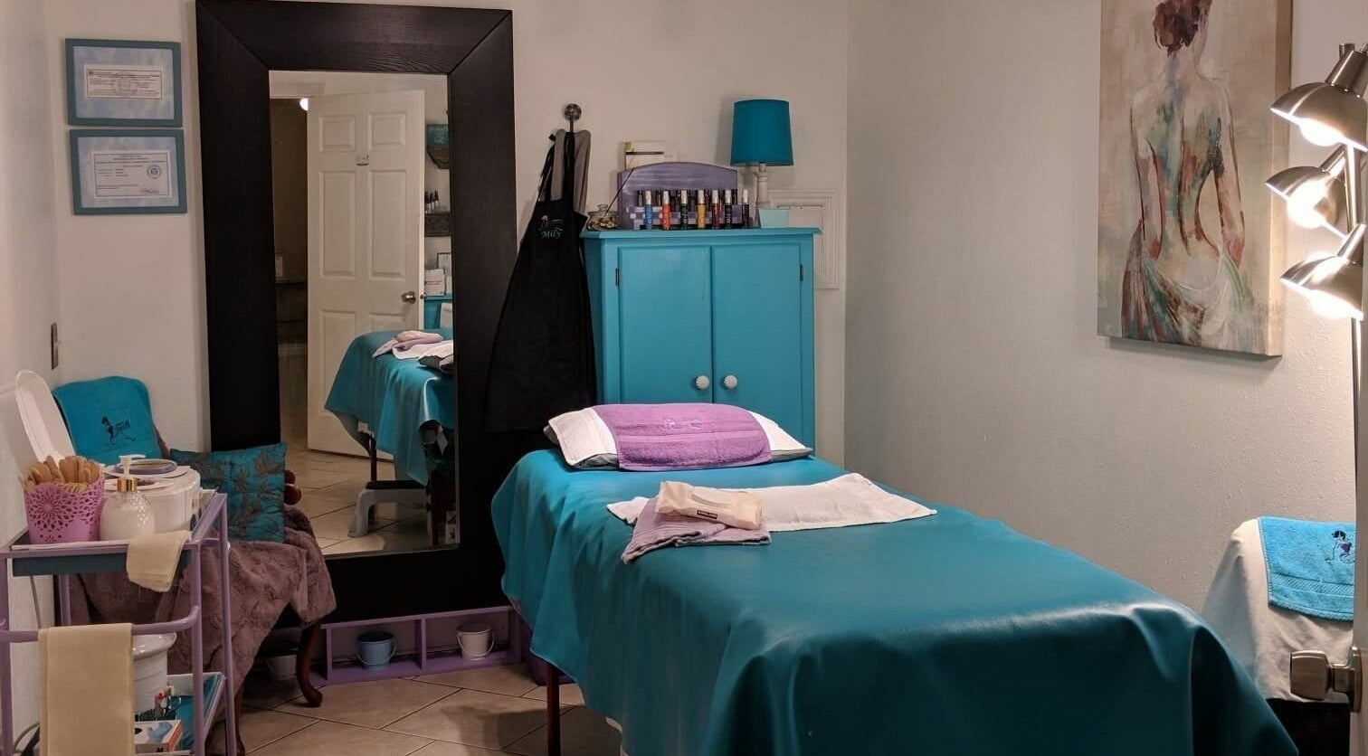 Relaxing treatment room at Always Smooth Waxing Studio in Taylorsville, Utah, US, showcasing a tidy and calming setup.