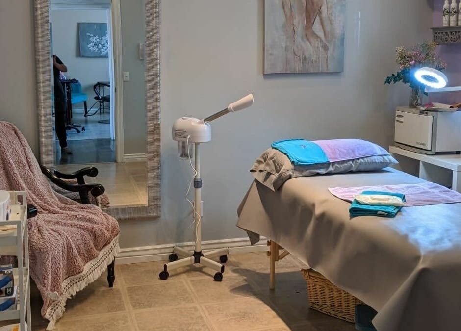 Cozy treatment room at Always Smooth Waxing Studio, Taylorsville, Utah, US, with a spa bed and calming decor.