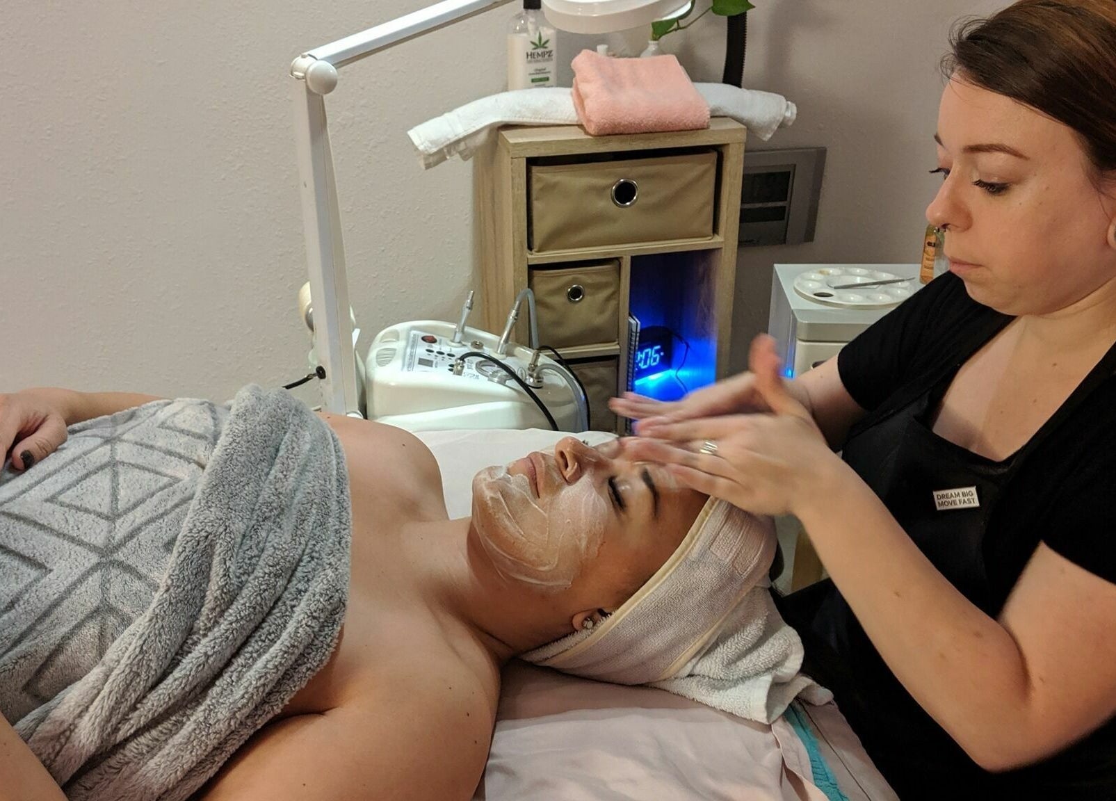 Facial treatment at Always Smooth Waxing Studio in Taylorsville, Utah. Aesthetician applying a soothing face mask.