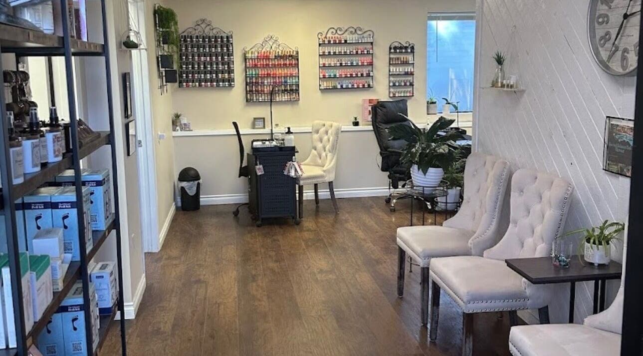 Chic interior of Studio J, Sandpoint, Idaho, US, featuring plush seating and nail polish displays.