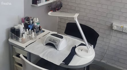 Nail treatment station at Diva's - The Home of Beauty, Doncaster, England, GB, showcasing manicure tools.