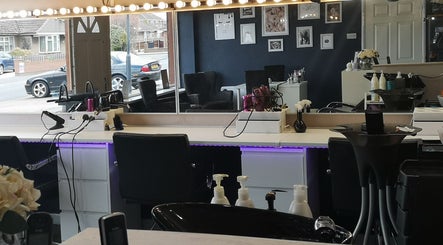 Chic salon interior at Diva's - The Home of Beauty in Doncaster, England, GB, showcasing styling stations.