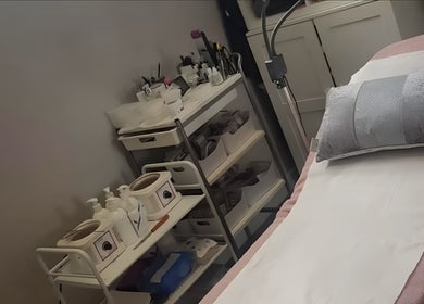 Cozy treatment room at Diva's - The Home of Beauty, Doncaster, England, GB, featuring a plush bed and beauty tools.