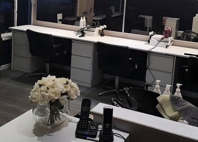 Elegant styling suite at Diva's - The Home of Beauty, Doncaster, England, GB with modern chairs and mirrors.