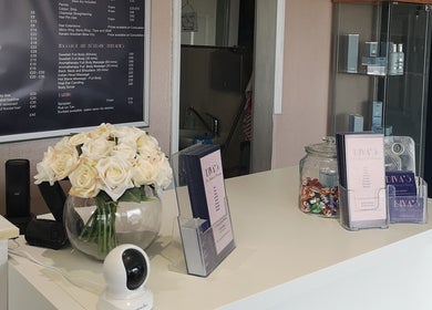 Reception desk at Diva's - The Home of Beauty, Doncaster, England, GB with flowers and brochures.