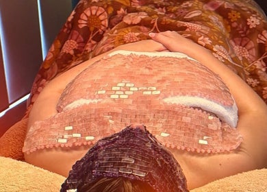Client enjoys a calming crystal therapy session at Soulful Skin Studio, South Penrith, New South Wales, AU.