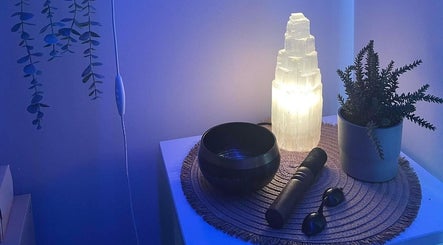 Elegant decor at Soulful Skin Studio, South Penrith, New South Wales, AU, featuring a glowing lamp and plant.