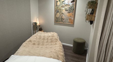 Comfortable therapy room at Soulful Skin Studio, Sydney, New South Wales, AU with cozy decor and ambient lighting.