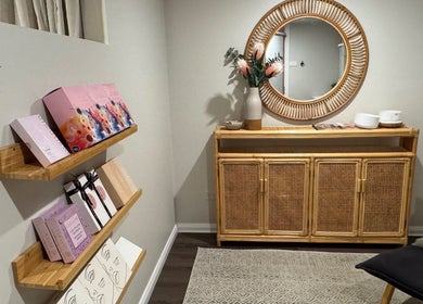 Elegant reception area of Soulful Skin Studio in Sydney, New South Wales, AU with decorative shelves and mirror.