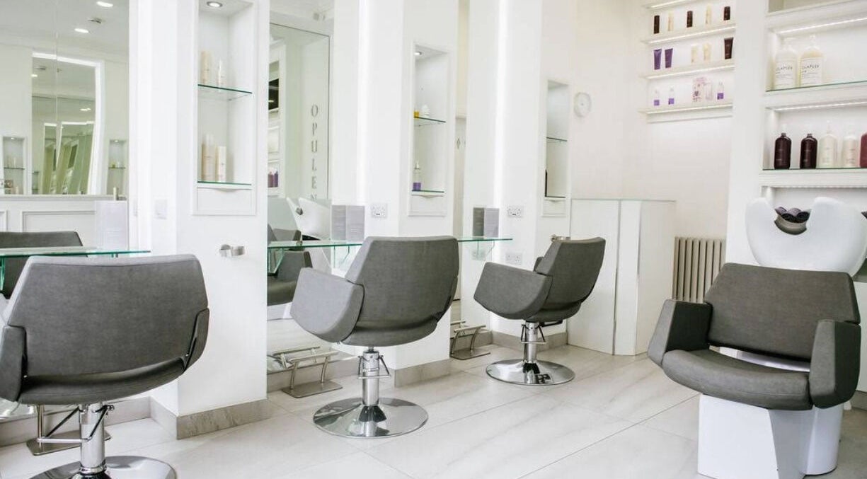 Modern salon chairs at Opulence Hairdressing in Lytham Saint Annes, England, GB, showcasing elegant design.