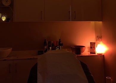 Utopia Beauty and Skincare Belfast's calming room in Castlereagh, Northern Ireland, GB with soft light and products.
