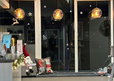 Cozy front desk at Utopia Beauty and Skincare Belfast in Castlereagh, Northern Ireland, GB with festive decor.