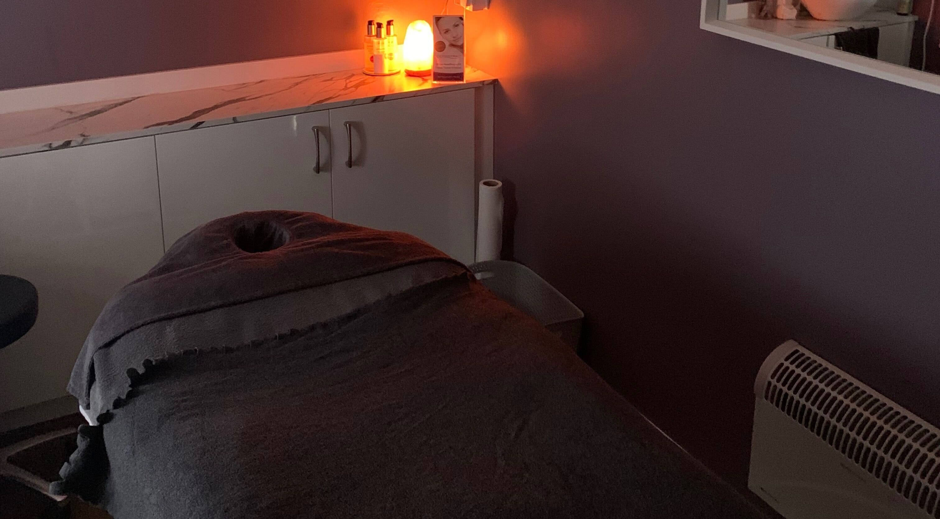 Calm treatment room at Utopia Beauty and Skincare Belfast, Castlereagh, Northern Ireland, GB with ambient lighting.