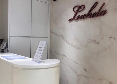 Elegant reception at Luchela Beautique (Central), Hong Kong Island, HK. Modern decor with marble accents.