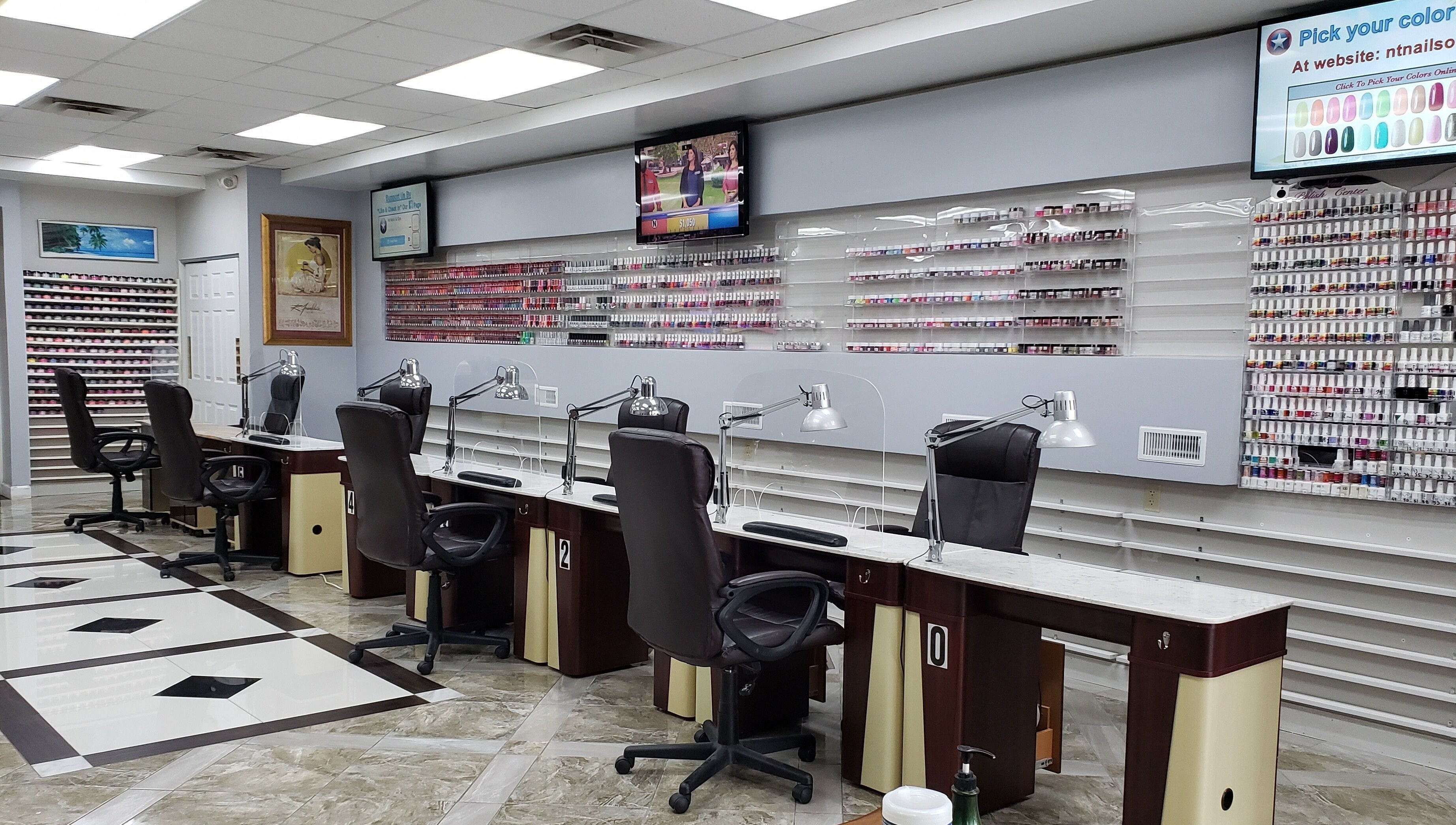Modern nail salon interior at NT Nails and Spa, West Chester, Ohio, US, featuring elegant manicure stations.